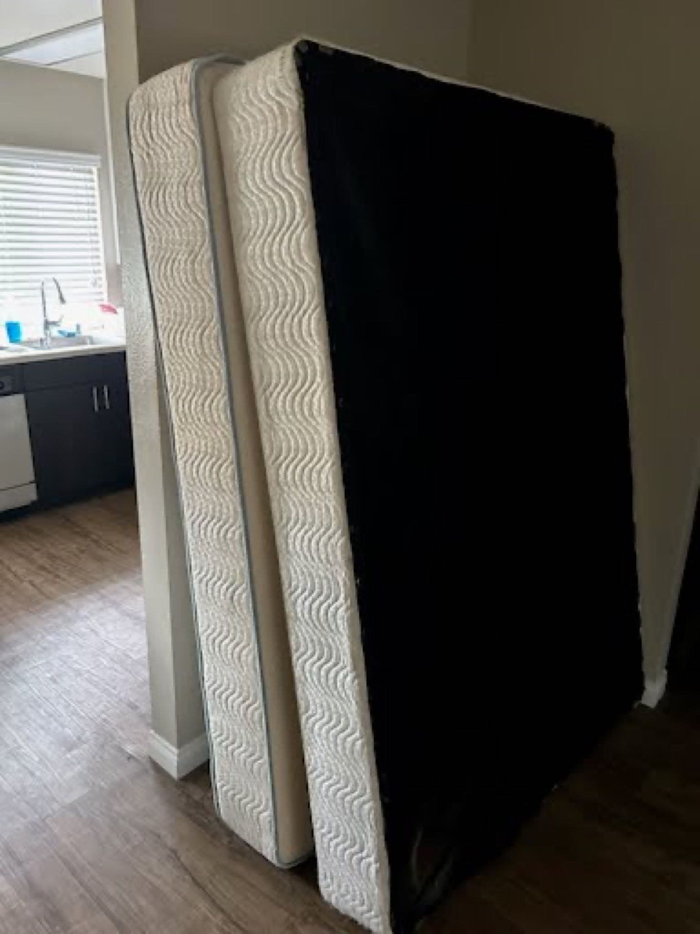 Stacked mattresses removed during a JunkMD+ San Diego property cleanout